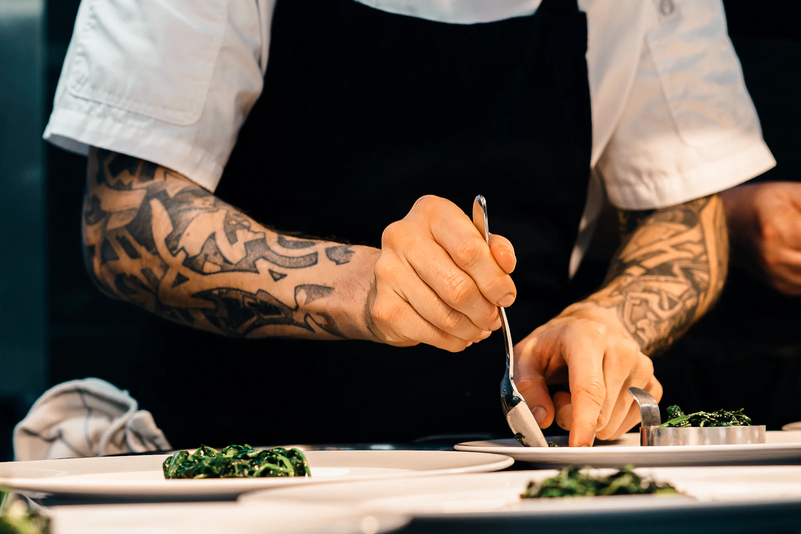The chef carefully finishing a plate
