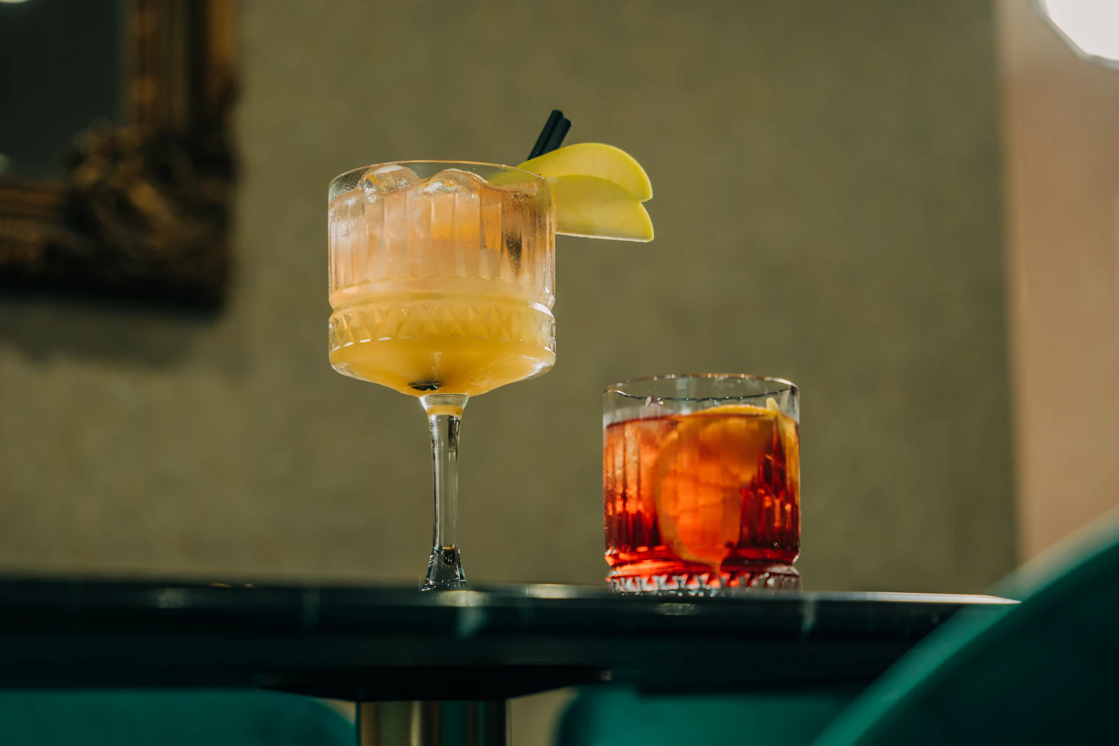 Two signature cocktails on the bar
