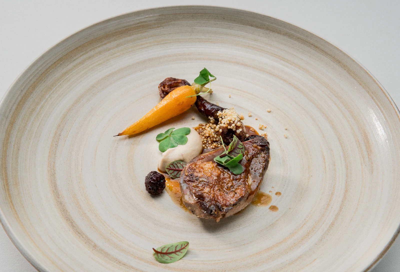 An elegant dish on a white plate